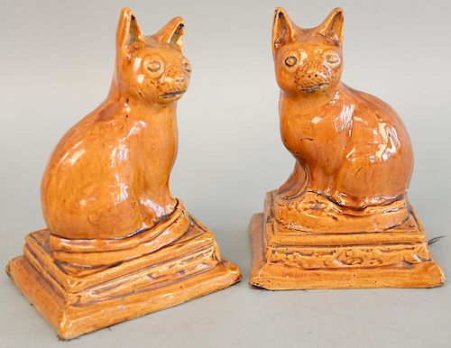 Pair of brown glazed pottery cat figures, DM+P Manheim label. ht. 7 1/2 in.