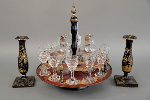 A regency gilt and red lacquered drinks stand, holding glasses and two decanters, early 19th century. ht. 13in., dia. 11 1/2 in. alo...