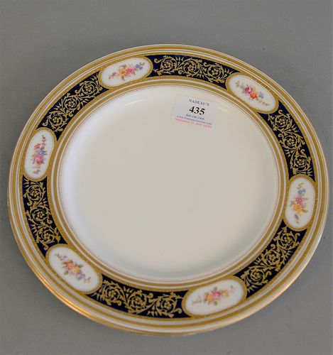 Set of eleven Burley porcelain blue ground dinner plates with raised gold, dia. 10 1/4 in.