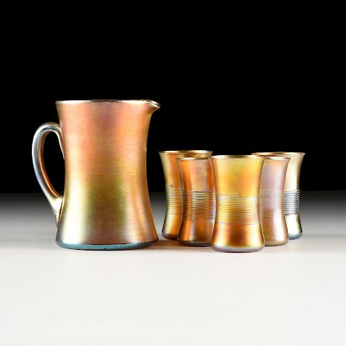 AN ASSEMBLED SIX PIECE LOUIS COMFORT TIFFANY FAVRILE GLASS PITCHER AND TUMBLER SET, ENGRAVED SIGNATURE, EARLY 20TH CENTURY,