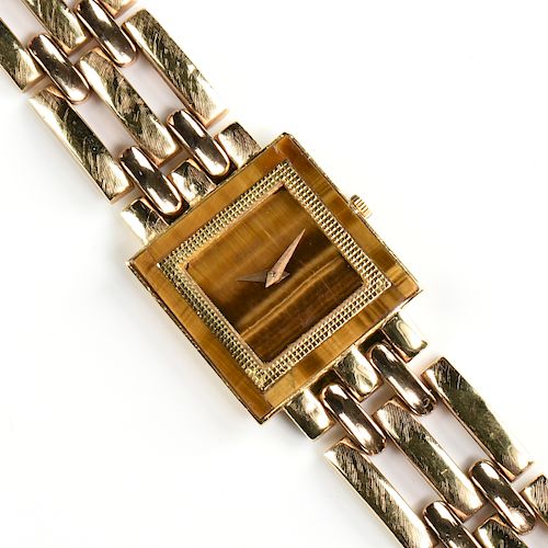 AN 18K YELLOW GOLD AND TIGER'S EYE PIAGET LADY'S WRISTWATCH,