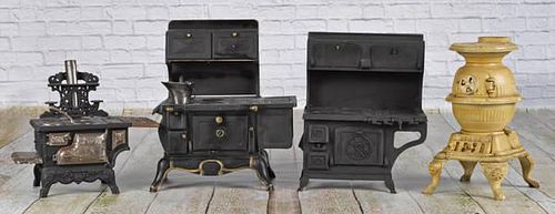 Four cast iron toy stoves, to include a Spark p