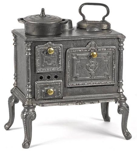 Cast iron toy cook stove, embossed 564, with a