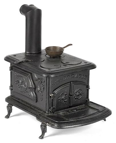 Cast iron Little Katie toy stove, 8'' h., 9 1/2''
