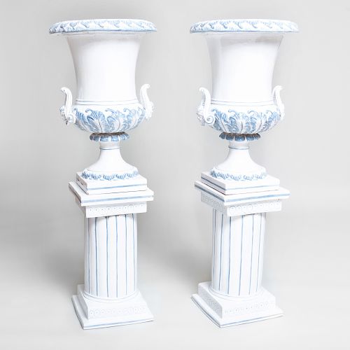Pair of Continental Tin Glazed Terracotta Urns on Pedestals