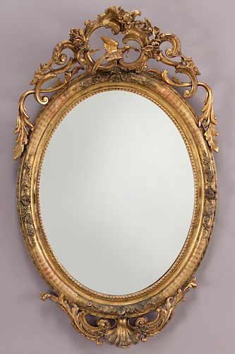 Carved gilt framed oval mirror,