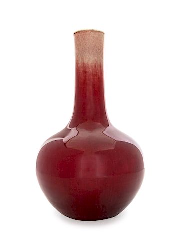 A Chinese Sang-de-Boeuf Glazed Porcelain Bottle Vase
Height 13 1/2 in., 34 cm.
