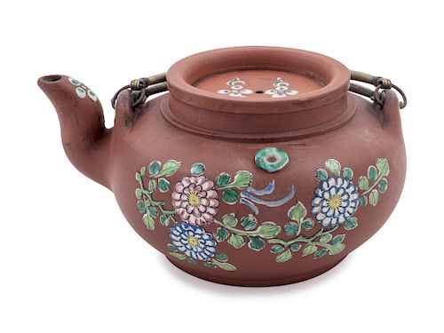 A Chinese Painted Yixing Pottery Teapot
Height 3 5/8 in., 9 cm. 