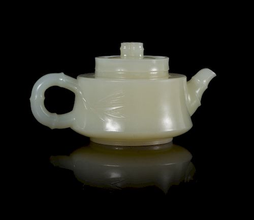 A Chinese White Jade 'Bamboo' Teapot
Width 3 7/8 in., 9.8 cm. 