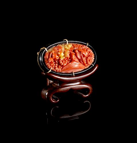 A Chinese Plastic Imitating Coral Inset Brooch
Width 2 1/8 in., 5 cm. 
