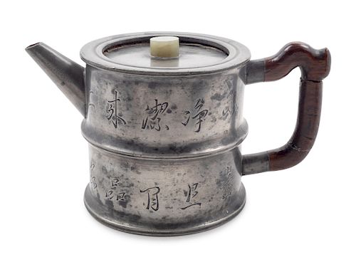 A Chinese Pewter Encased Yixing Pottery Teapot
Height 3 1/2 in., 9 cm. 