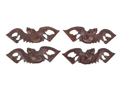 A Set of Four Chinese Hardwood Bat-Form Panels
Each: length 15 1/2 length in., 39 cm. 