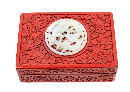 A Chinese Pale Celadon Jade Inset Carved Red Lacquer Rectangular Box and Cover
Height 1 7/8 x width 5 3/4 x depth 3 7/8 in., 5 x 10 x 15 cm.