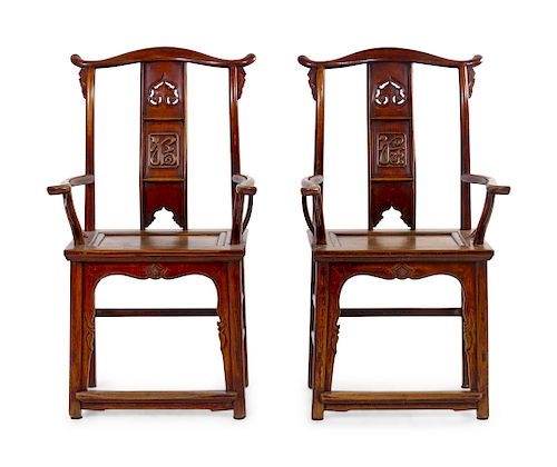 A Pair of Chinese Elmwood Armchairs
Each: height 45 3/4 in., 116 cm.