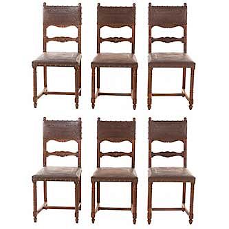 Lote de 6 sillas. Francia. Siglo XX. Estilo Enrique II. En talla de madera de nogal. Con respaldos semiabiertos y asientos de piel.