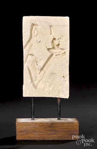 Egyptian limestone sunk relief fragment