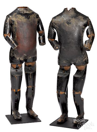 Pair of wood and leather articulated mannequins