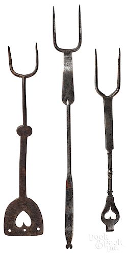 Three wrought iron utensils