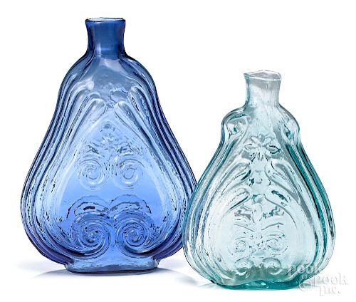 Two midwestern glass scroll flasks, mid 19th c.