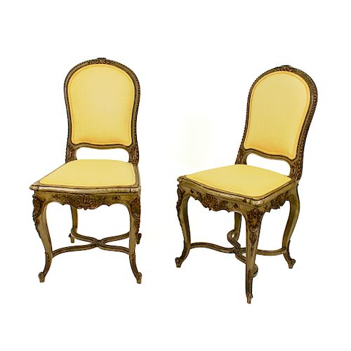A Pair of French Louis XV Style Painted and Parcel Gilt Side Chairs
19TH CENTURY
having upholstered back rest and seat.
Height 36 1/2 inches.