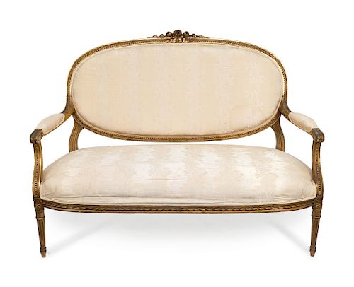 A Five-Piece Louis XVI Style Carved Giltwood Parlour Suite 
Canape, height 34 x width 54 inches.