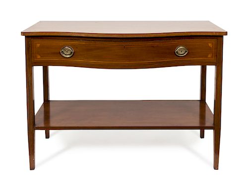 A Hepplewhite Style Mahogany Console Table
Height 34 1/2 x width 48 x depth 20 1/2 inches.