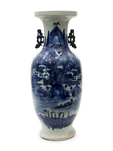 A Chinese Blue and White Vase
Height 23 inches.