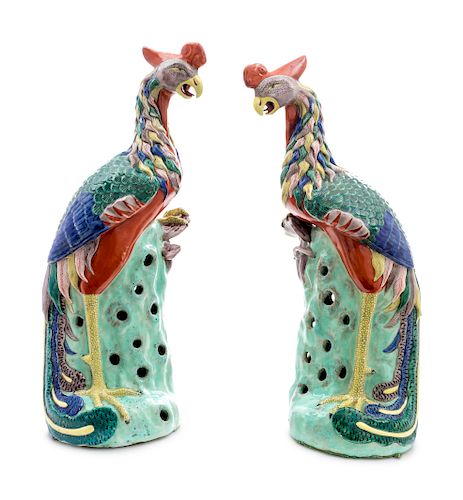 ligA Pair of Chinese Export Porcelain Phoenix Birds
EARLY 20TH CENTURY
on pierced bocage bases.
Height 19 1/2 inches.