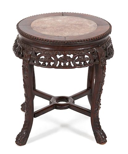 A Chinese Carved Hardwood Table with Inset Marble Top 
Height 19 x diameter 17 1/4 inches.