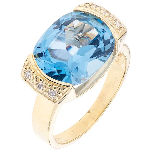 A topaz and diamond 14K yellow gold ring . 