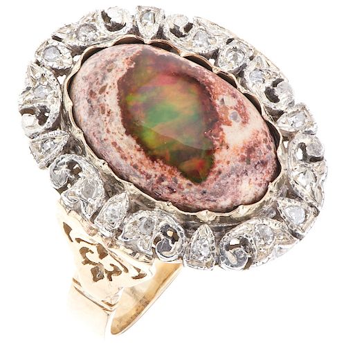 An opal and diamond 14K yellow gold ring. 