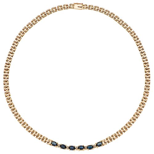 A sapphire and diamond 14K yellow gold necklace. 