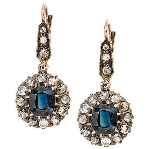 A sapphire and diamond 18K pink gold and silver pair of earrings.