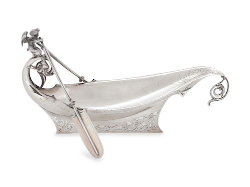 An American Silver Bowl,
Gorham Mfg. Co., Providence, RI, 20th Century
in the form of a boat surmounted with cherub with oars.
