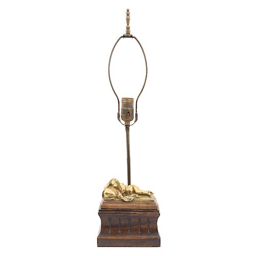 TABLE LAMP. MEXICO, BEGINNING OF THE 20TH CENTURY. Wood with bronze aplications. Electrified for one light. Decored with a figure of a slepping infant