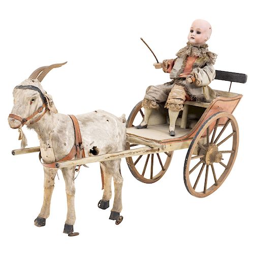 INFANT WITH CART AND GOAT. END OF THE 19TH CENTURY. Polychromed wood, porcelain in face and hands.