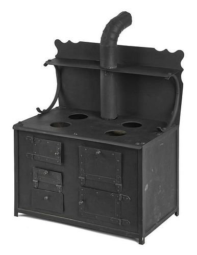 Tin and cast iron toy stove, 21 1/4'' h., 17 3/4''