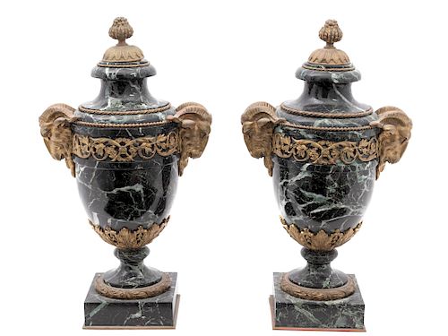 A Pair of Louis XV Style Gilt Bronze Mounted Marble Urns
Height 16 1/2 inches.