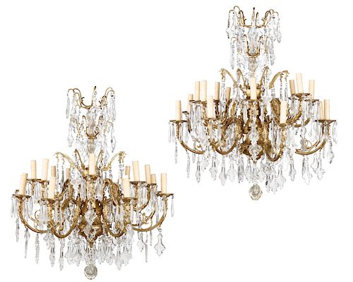 Pair of bronze & glass sixteen light chandeliers