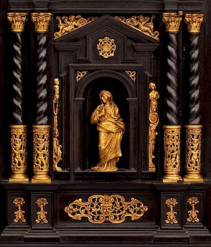 A Spanish Baroque style ebonized cabinet on stand