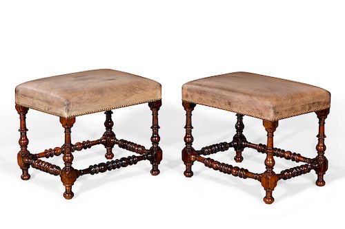 Pair of Continental Baroque carved walnut stools
