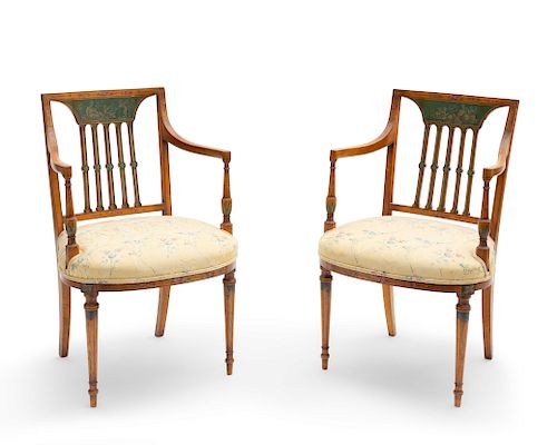 A pair of George III style satinwood armchairs