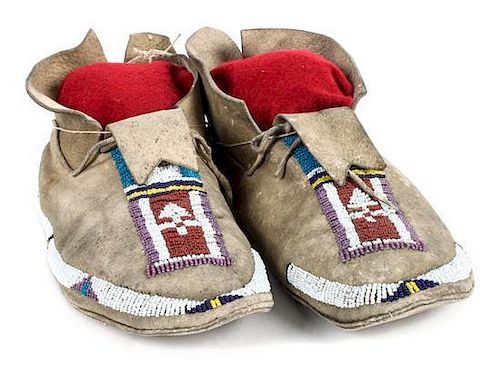 A Pair of Cheyenne Beaded Moccasins Length 10 1/2 inches.