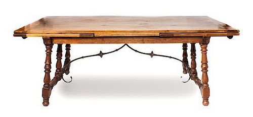 A Spanish Style Extension Table, Joseph F. Milbeck Height 30 1/2 x length 84 1/4 x 39 7/8 inches (closed).