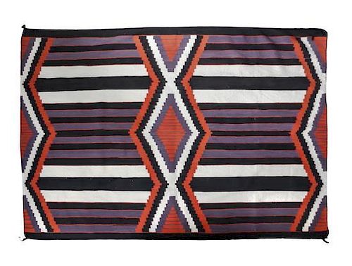 A Navajo Weaving in Fourth Phase Design 58 x 83 1/2 inches.