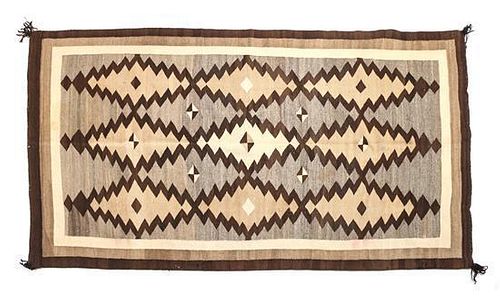 A Navajo Crystal Rug First: 75 1/2 x 46 1/2 inches.