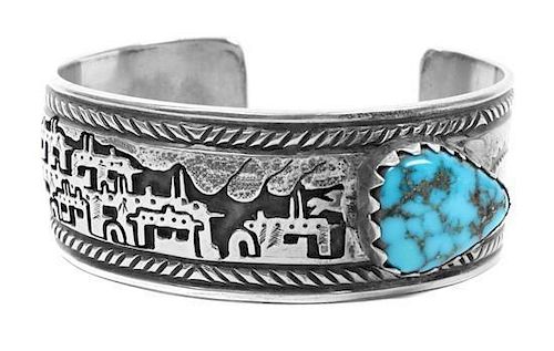 A Tewa Silver Storyteller Bracelet, Vidal Aragon Length 5 1/2 x opening 1 x with 7/8 inches.