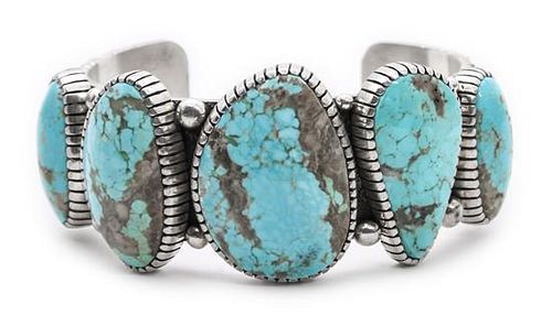 A Navajo Turquoise Bracelet, Edison Begay Length 5 7/8 x opening 1 2/8 x width 1 3/8 inches.