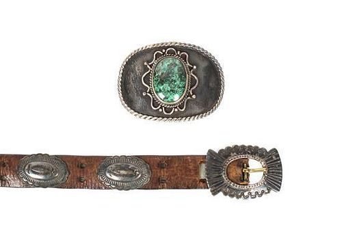 A Southwestern Concho Belt Length of first overall 41 inches, buckle 1 3/4 x 2 1/2 inches.