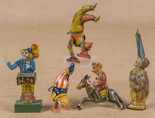 Four tin litho wind-up clowns, to include a Germa
